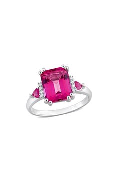 A row of diamonds tenderly frames a colorful emerald-cut pink topaz stone with a sterling silver prong set ring. Sterling silver/pink topaz/white diamonds Total diamond weight: 0.04ct Imported Diamond Guide Pink Emerald Cut Sterling Silver Ring, Pink Emerald Cut Jewelry With Halo Setting, Pink Emerald-cut Jewelry With Halo Setting, Pink Emerald-cut Diamond Ring In Fine Jewelry, Pink Emerald Cut Diamond Ring Fine Jewelry, Pink Radiant Cut Jewelry With Accent Stones, Radiant Cut Pink Jewelry With Accent Stones, Pink Emerald Cut Diamond Ring, Pink Emerald-cut Diamond Ring