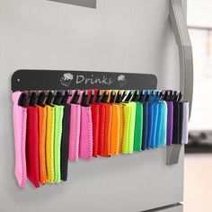 there is a rack that has many different colors on it and the name drinks written on it