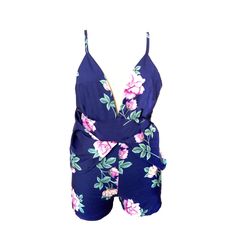 This sweet but sassy romper is absolutely perfect. Featuring a plunging v-neckline, a fitted top with spaghetti straps to an open back and crisscross straps, an empire waist and a flowing open skirt over fitted shorts that fall mid-thigh. This romper pairs perfectly with wedges, heels or sandals to go from a a cute and casual day look to a night on the town. Made with a polyester and cotton blend for comfort and style. Summer V-neck Jumpsuit With Tie Back, Flirty V-neck Jumpsuit For Date Night, Summer Party Jumpsuits With Crisscross Straps, Chic Floral Print Jumpsuit With Spaghetti Straps, V-neck Party Jumpsuit With Tie Back, Summer V-neck Jumpsuits And Rompers With Floral Print, V-neck Tie Back Jumpsuit For Party, Summer Floral Print V-neck Jumpsuits And Rompers, Flirty Backless Summer Jumpsuit/romper