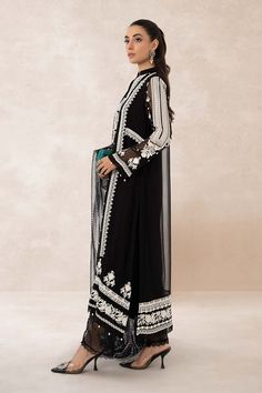 Traditional Black Shade Pakistani Salwar Kameez Embroidered Suit is a perfectly stitched masterpiece that will win everyone's hearts at the very first glance with its charm and elegance. The lavish contrast of black shade and premium quality of the fabric makes it an epitome of beauty and grace. Detailed Description: SKU: PB921 Detailing: Embroidery, Threads Color: Black Fabric: Net, Organza Design: Fully Embroidered dress Event: Festive, Party wear Festive Black Georgette Salwar Kameez, Black Georgette Anarkali Set For Eid, Eid Black Georgette Anarkali Set, Bollywood Style Black Palazzo Set For Festive Season, Bollywood Style Black Palazzo Set For Festive Occasions, Bollywood Style Black Palazzo Set For Eid, Festive Bollywood Style Black Palazzo Set, Bollywood Black Palazzo Set For Eid, Elegant Black Georgette Sharara