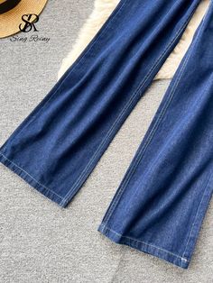 SPECIFICATIONSBrand Name: SR.SingreinyDecoration: ButtonDecoration: PocketsDecoration: Bright Line DecorationStyle: StreetwearMaterial: AcrylicMaterial: SPANDEXMaterial: Cotton BlendsElasticity: Non StrechFabric Type: DenimPattern Type: SolidFit Type: Regulai FitAge: 25-34Clothing Length: shortPlace Of Origin: China (mainland)Pant Length(cm): full lengthOrigin: Mainland ChinaCN: GuangdongSeason: SummerCollar: Turn-down CollarWaist: High WaistClosure Type: PulloverSleeve Style: regularMaterial Composition: synthetic fiberPant Style: Wide leg pantsFront Style: FlatPant Closure Type: zipper flySleeve Length(cm): shortGender: WOMENRelease Date: Winter 2022Clothing Patterns: STRAIGHT Streetwear Denim, Retro Tops, Vintage Suits, Loose Blouse, 2024 Fashion, Long Puff Sleeves, Fashion Korean, Wide Legs, Sleeves (women)