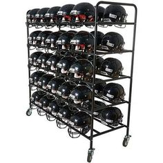 a rack filled with black helmets on wheels