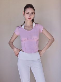 It keeps you nice and cool.Meet our crisp and light weight top. It's easy to wear, comfortable and looks good with just about everything. - Pair it easily with jeans for an effortlessly cool vibe- Soft and comfy with cotton blend - V-neck and rounded hem slim fit top - Halter neck and cap sleeves- Brand log label on the cuffs - It's easy to wear, comfortable and looks good with just about everything Summer V-neck Crop Top For Layering, Fitted V-neck Top For Everyday, Casual Fitted V-neck Blouse, Casual V-neck Top For Layering, Versatile Fitted T-shirt For Spring, Fitted Short Sleeve Top For Spring, Feminine Fitted Short Sleeve Tops, Fitted Feminine Short Sleeve Tops, Casual Stretch Short Sleeve Top