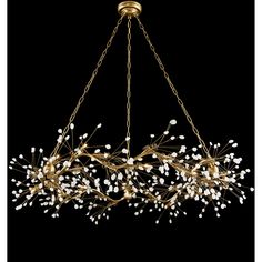 a large chandelier with white flowers hanging from it's golden frame and chain