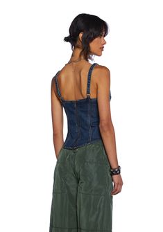 This corset top has a washed denim construction, adjustable shoulder straps, structured boning on the sides, a front lace lace-up design with ties on the front, and a back zipper closure. Casual Denim Blue Cotton Corset, Casual Blue Cotton Corset, Fitted Denim Tops With Adjustable Straps, Casual Sleeveless Denim Corset, Dark Wash Summer Corset, Dark Wash Denim Corset For Summer, Casual Denim Blue Corset For Summer, Casual Denim Sleeveless Corset, Casual Denim Blue Summer Corset