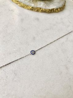 Beautifully light Sterling Silver chain bracelet with Cubic Zirconia Evil Eye charm; adjustable in length up to 7.5 inches This bracelet is perfect for gifting with our matching necklace & stud earrings also available:Necklace:https://www.etsy.com/uk/listing/727886349/sterling-silver-evil-eye-necklace?ga_search_query=Evil%2Beye&ref=shop_items_search_5Earrings:https://www.etsy.com/uk/listing/826524760/sterling-silver-evil-eye-earrings?ga_search_query=Evil%2Beye&ref=shop_items_search_6 Resizable Silver Jewelry For Everyday, Everyday Resizable Silver Jewelry, Dainty Round Jewelry With Adjustable Length, Resizable Sterling Silver Jewelry For Gifts, Adjustable Hypoallergenic White Gold Chain Bracelet, Adjustable Sterling Silver Chain Bracelet, Tarnish Resistant, Silver Adjustable Chain Bracelet As Gift, Silver Adjustable Chain Bracelet Gift, Adjustable Sterling Silver Chain Bracelet For Her