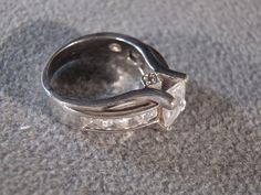 I am offering you this gorgeous vintage sterling silver (stamped) 3 stone engagement wedding band ring with a gorgeous square shaped genuine full cut cubic zirconia stone. It is accented with 2 trillion / triangle shaped genuine cubic zirconia stones. It is set in a wonderful east to we wide fashion with a heavily etched eternity design. This ring is spectacular, featuring a fabulous bold thick very elegant setting. This stone has color saturation and intensity that is endless, as seen in the pr 9 Square, Wedding Band Ring, Stone Engagement, Triangle Shape, Ring Size 7, White Topaz, Engagement Wedding, Wedding Ring Bands, Band Ring