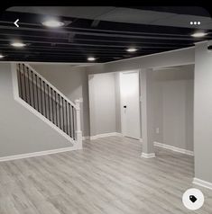 an empty room with hard wood flooring and white painted walls is pictured in this image