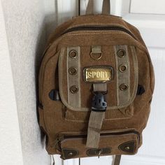 Unisex Tan/Brown Backpack Nwt Made Of Burlap-Type Material. One Pocket On Both Sides And Front Zippered Pocket. Ombr Discoloration On Tag Is Intentional. Beautiful Bag. 16”H X 12”W X 6”D (Or Even Slightly Larger) Casual Brown Backpack For Hiking, Brown Backpack With Adjustable Strap For Outdoor Activities, Brown Backpack With Adjustable Strap For Outdoor, Casual Beige Backpack For Outdoor Use, Casual Beige Backpack For Outdoor Activities, Casual Khaki Hiking Bag, Casual Brown Bags For Outdoor Activities, Casual Brown Bag For Outdoor Activities, Casual Brown Bags For Outdoor