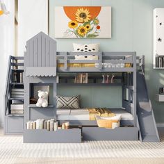 a child's bedroom with a bunk bed and stairs to the second floor is shown