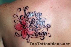 the back of a woman's shoulder with a flower tattoo on her left side