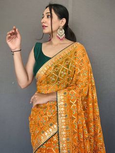 Get ready for any event with our attractive yellow printed georgette event wear saree with a blouse! This stunning saree comes in a light and breezy georgette material with a bandhani print all over. It also features a gotta pati lace border and tassels work for a beautiful finish. The set also includes a green blouse made of georgette material and features a gotta patti lace border. With a versatile 5.50 meters long saree and stitched 1.00 meters blouse, you can dress this saree up or down for Festive Saree, Bandhani Print, Georgette Material, Saree Georgette, Gotta Patti, Print Saree, Color Blouse, Indian Wedding Wear, Plain Blouse