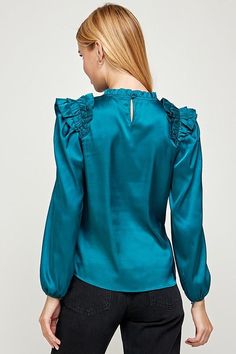 long sleeve top with pleated ruffle detail.