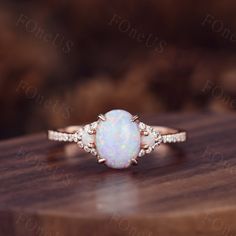 Vintage Oval white Opal Engagement Ring moissanite side stone in rose gold. Moissanite Bridal Wedding Ring,Art Deco,Unique Setting, Wedding Band In solid 14k or 18k rose/white/yellow gold,Promise ring,Christmas Gift,Anniversary gift for her. Details --Engagement Ring-- Stone: Moissanite Weight: 1.5 Carat Stone Size: 6x8mm Shape: Oval cut Side stones: Opal + Moissanite ◇◇Processing time◇◇ Any item on my store is handmade,made to order,no stock. Typically,it takes 3-4 weeks to complete the item. ◇◇Delivery time◇◇ --Domestic-- Standard shipping:5-7 working days for arrival Express shipping:2-4 business days for arrival --Overseas-- Standard shipping:1-2/3-4 weeks for arrival Express shipping:3-5 business days for arrival ❤I'll do my best to meet these shipping estimates, but cannot guarantee Boho Vintage Engagement Ring, Gold Three Stone Engagement Ring, Oval Opal Ring, White Opal Engagement Ring, Rose Quartz Ring Engagement, Opal Promise Ring, Rose Gold Opal Ring, Engagement Ring Moissanite, Engagement Ring Oval