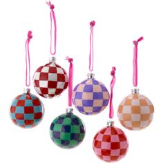 four christmas ornaments hanging from pink ribbon on white background with checkerboard pattern ornament