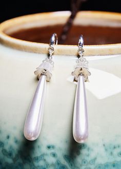 Elegant White Water Droplet Pearl Drop Earrings925 Silver.Made of fine Pearl.Measurement: 6.4cm/2.496" * 1cm/0.39". Matches easily with daily hairstyle, dresses & Shirts Elegant Long Drop Clip-on Earrings For Gifts, Sterling Silver Clip-on Earrings For Wedding, Elegant Silver Teardrop Clip-on Earrings, Drop Clip-on Earrings For Wedding, Daily Hairstyles, Water Droplets, Pearl Drop Earrings, Pearl Drop, Drop Earrings