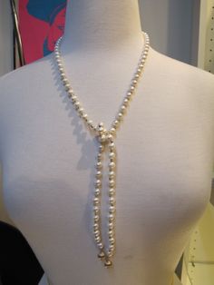 "Elegant, but fun vintage pearl and alternating gold bead necklace. Necklace is open at the front, you can knot it yourself at whatever length you choose. It oddly has a magnetic clasp at the back.  Each pearl measures approximately 7.5mm. Each gold bead measures approximately 3.2mm. Total length 36\" and total weight of 51 grams.   10650-100" Adjustable Pearl White Lariat Necklace, Adjustable Lariat Pearl White Necklace, Pearl Lariat Necklace With Single Strand, Elegant Beaded Pearl Lariat Necklace, Elegant Pearl Beaded Lariat Necklace, Adjustable Pearl Lariat Beaded Necklaces, Adjustable Pearl Beaded Lariat Necklace, Adjustable Lariat Pearl Beaded Necklaces, Lariat Pearl Necklace With Charm For Parties