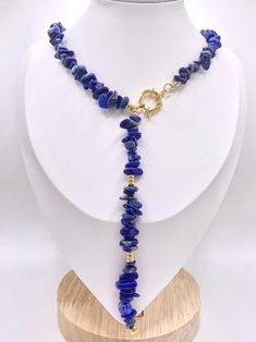 Lapis Lazuli chipped bead necklace with stainless steel spacers and clasps.  Neck Clasp Length: approximately 17-18 inches Full Length: 22 inches Lapis Lazuli is known for its powerful connection to wisdom, truth, and inner peace. This striking blue gemstone has been treasured for centuries, believed to enhance self-awareness and help you express your authentic self. Whether you're seeking clarity, emotional healing, or simply a statement piece that speaks to your soul, these pieces are designed to align with your journey. 💎 Benefits of Lapis Lazuli: Enhances intuition and insight Promotes communication and self-expression Encourages emotional balance and self-confidence Each necklace is uniquely handcrafted. Due to the organic nature of Lapis Lazuli, slight variations in shape, color, an Chip Bead Necklace, Blue Lapis Lazuli, Authentic Self, Chip Beads, Blue Gemstones, Emotional Healing, Inner Peace, Bead Necklace, Lapis Lazuli