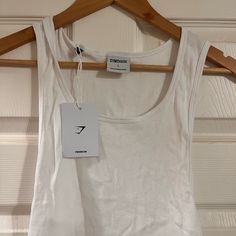 White Tank. New With Tags Basic White Cotton Tank Top, White Cotton Basic Tank Top, Everyday White Ribbed Tank Top, Fitted White Tank Top For Everyday, White Cotton Scoop Neck Top, White Crew Neck Tank Top, White Scoop Neck Top For Spring, White Crew Neck Tank Top For Spring, White Scoop Neck Top For Everyday