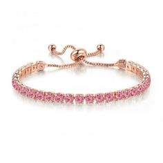 a pink bracelet with diamonds on it