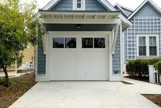 two garages are shown in front of some houses