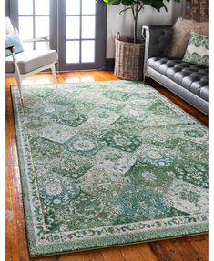 a living room with a couch, chair and rug