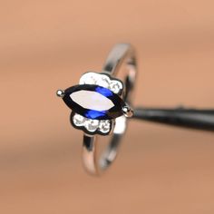 It is a lab sapphire ring. The main stone is 5 mm*10 mm marquise cut.weight about 1.18 carats.The basic metal is sterling silver and plated with rhodium.To change the metal to a solid gold (white/rose) or platinum is also available, please ask for a quotation if you want.You can also go to my shop Home for more elegant rings: https://www.etsy.com/shop/godjewelry?ref=hdr_shop_menu Sapphire is the September birthstone.More sapphire rings:https://www.etsy.com/shop/godjewelry?section_id=20715031Cust Elegant Rings, Ring Blue Sapphire, Gemstone Properties, Blue Sapphire Ring, Ring Blue, September Birthstone, Proposal Ring, Elegant Ring, Blue Sapphire Rings