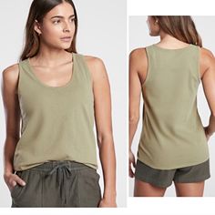 Nwt Athleta Organic Daily Tank Color: Shadow Olive Size: 1x New With Tags. No Marks, Odors, Flaws, Or Defects. Lightweight Organic Cotton Is Stretchy And Soft. The Scoop Neckline Flatters Your Form. Organic Cotton. Sustainable Easy Care Machine Wash And Dry. Skims Easily Over The Body. Body Length In 1x Plus: 25", Armpit To Armpit 21.5" Smoke/Fragrance/Dust-Free Home. Bundle Items To Receive Discounts And One Shipping Fee! Casual Cotton Tank Activewear, Green Scoop Neck Tank Top For Loungewear, Casual Crew Neck Tank Top For Workout, Basic Relaxed Fit Tank Top For Workout, Summer Tank Activewear, Summer Tank Activewear For Everyday, Everyday Sleeveless Athleisure Tops, Casual Scoop Neck Tank Top With Relaxed Fit, Relaxed Fit Solid Tank Top For Workout