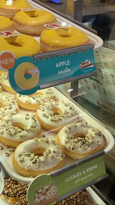 a display case filled with lots of different kinds of doughnuts