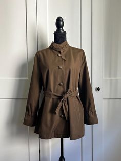 Short Minimalist Jacket, Brown Jacket, Light 90s Jacket TO AVOID THE RETURNS AND FOR THE SAKE OF THE ENVIRONMENT, please pay close attention to the description and measurements of the clothing. If you need any help, do not hesitate to contact me. Thank you for your understanding. Short trench-like jacket in brown color with beautiful buttons, two side pockets, and a belt to tie. It is very minimal, with special little details. Perfect for spring and fall outfits. It fits best women's size M, but Brown Collared Utility Jacket With Buttons, Brown Collared Utility Jacket For Workwear, Collared Brown Utility Jacket For Workwear, Brown Double-breasted Outerwear With Belted Cuffs, Brown Utility Jacket With Button Closure For Spring, Brown Utility Jacket With Buttons, Spring Brown Utility Jacket With Button Closure, Brown Double-breasted Belted Outerwear, Brown Button-up Utility Jacket For Work