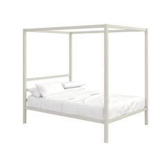 a white bed frame with pillows on it