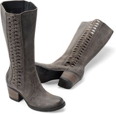 two women's boots with laces on the sides, one in grey suede