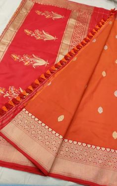 Orange and  Pure Katan silk Benarasi sari with floral motifs. Comes with fall pecko and tassles. Luxury Orange Katan Silk Traditional Wear, Banarasi Silk Dupatta With Latkans For Traditional Ceremonies, Festive Art Silk Saree With Latkans, Festival Banarasi Silk Saree With Latkans, Traditional Banarasi Silk Wear With Latkans, Art Silk Saree With Latkans For Festivals, Traditional Wear Banarasi Silk With Latkans, Banarasi Silk Traditional Wear With Latkans For Navratri, Traditional Wear In Banarasi Silk With Latkans