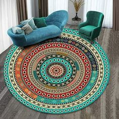 a living room area with a round rug on the floor and two chairs in front of it