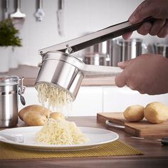 a person grating noodles from a pot onto a plate