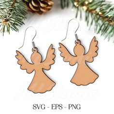 two wooden angel earrings hanging from a christmas tree