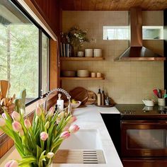 a kitchen filled with lots of counter top space next to a stove top oven and microwave