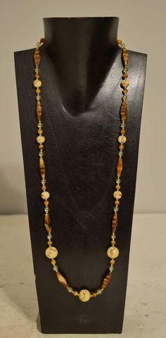 "This is a Lovely Necklace with Tiger Coral Round beads, Tiger Eye Glass Tubes and Bead s, Glass and Brass Beads all strung on wire with a gold lobster claw clasp. This necklace was part of the Bacara Jewelry Collection of 25 with years ago. This is a a lovely necklace which is lightweight to wear and will compliment any outfit and looks fabulous on. A great gift to give that special someone. Necklace 31\" long Bead 28\" long Tiger Coral Beads 10mm - 14mm round Tiger Eye Glass Tubes 24mm long 8m Coral Jewelry Necklace, Eye Glass, Coral Jewelry, Beaded Bracelets Diy, Lovely Necklace, Coral Beads, Tube Beads, Jewelry Necklace, Tiger Eye