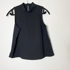 Express Factory Blouse. Black With High Neckline Style. Zip Back. Condition: Nwt Materials: 100% Polyester Bust: 19" Laid Flat Armpit To Hem: 12" Length: 23" (All Measurements Are Approximate) *Bundle 2 Or More Items For A Discount #2305t Black High Neck Tank Top For Night Out, Sleeveless Blouse For Fall Layering, Spring Black High Neck Tank Top, Black High Neck Tank Top For Spring, Sleek Sleeveless Blouse For Work, Stretch Black Top For Office, Black Fitted Versatile Blouse, Versatile High Neck Tops For Workwear, Versatile High Neck Top For Workwear