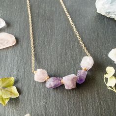 This simply beautiful necklace is a perfect compliment to any outfit! This minimalist piece is made with: *Purple Fluorite rough cut nuggets  *Gold-filled spacer beads *Gold-filled chain and clasp See the matching earrings here:  https://www.etsy.com/listing/813821679/gold-purple-rough-cut-fluorite-earrings Each item is handmade with care and packaged in earth-friendly bio-degradable plastic bags with a tarnish-free tab included to keep your jewelry looking brand new. All of our jewelry is made with professional-grade wire and chain. All wires are designer quality, tarnish-resistant precious metals (either sterling silver, rhodium-plated sterling silver, or gold-filled). If you select the gift wrapping option, your items will be wrapped in an eco-friendly gift box with raffia ribbon and gi Dainty Purple Necklace For Everyday Wear, Minimalist Amethyst Necklace For Gift, Minimalist Purple Necklace For Everyday, Minimalist Amethyst Necklace Gift, Everyday Purple Amethyst Necklaces, Minimalist Handmade Amethyst Necklace, Minimalist Purple Jewelry For Everyday, Minimalist Purple Necklace For Gift, Minimalist Amethyst Purple Necklace