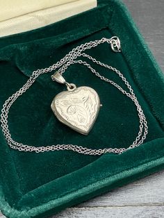 Vintage  silver locket for women. Double sided silver locket with hand engraved back and front.  Silver heart locket. Silver pendant . Silver necklace for women.       Vintage circa 70s. Condition: necklace in perfect vintage condition. Materials: Silver. Rhodium plated silver chain.  Measure: chain 16"/ 41 cm,   Locket  0.7" x 0.7"/  1.8 x 1.8 cm. Package: gift wrap available, please specify when ordering. Delivery: your order will be send by Royal Mail with tracking and signed in 1-2 working d Hallmarked Medallion Jewelry For Keepsake, Medallion Jewelry Hallmark Keepsake, Silver Locket Jewelry For Mother's Day, Keepsake Medallion Jewelry With Hallmark, Etched Silver Jewelry For Mother's Day, Engraved Jewelry Collectible For Valentine's Day, Mother's Day Silver Locket Jewelry, Mother's Day White Gold Locket Necklace Gift, Mother's Day Gift White Gold Locket Necklace