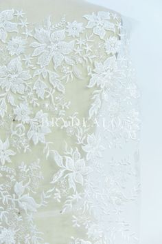 This beautiful designer lace fabric features delicate flower pattern embroidered on soft tulle base with beading and clear sequins adorned, which is perfect for making romantic wedding dresses. sold by the yard shown color light ivory content nylon, polyester, PET weight medium weight elasticity no width approx. 130cm washing instructions hand wash/drip dry Romantic Wedding Dresses, Embroidered Lace Fabric, Light Ivory, Soft Tulle, Wedding Dresses Romantic, Drip Dry, Delicate Flower, Embroidered Lace, Embroidered Flowers