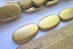 some rocks and a ruler on a table