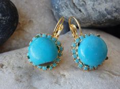 Gold Turquoise Drop Earrings, Turquoise Jewelry, Blue Gemstone Earrings, Reiki Earrings, Rounded Turquoise Earrings, December BirthstoneThese earring have a big wow factor. No one can ignore you when your wear These. They look like they belong to a royal princess of an ancient era. Great for a party or anytime you want to look glamorous and chic.Metal: 24K Gold platedGemstone: Turquoise, SwarovskiLength: 1.4 cm (0.55 Inches)Stone Size: 1 cm (0.4 Inches)The earrings will be packed in a gift box.P Turquoise Gemstone Drop Earrings, Turquoise Drop Earrings With Gemstone Accents, Turquoise Dangle Earrings With Gemstone Accents, Vintage Style Wedding Rings, Turquoise Earring, Blue Gemstone Earrings, Turquoise Gold Ring, Turquoise Stud Earrings, Turquoise Drop Earrings