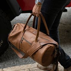 A more streamlined, sportier take on a weekend bag, the Reclaimed duffel is perfect for an overnight or a stylish visit to the gym. The look may be a throwback but the features are thoughtfully modern. The extended zipper closure allows for easier packing; the zippered stash pocket on the exterior keeps essentials secure and accessible; and the assortment of interior drop-in and zip pockets keeps you organized. This Reclaimed leather duffel is durable but light, so the bag remains easy to carry, Leather Duffle Bag Men, Leather Duffel Bag, Leather Duffel, Leather Company, Sac Week End, Easy Packing, Leather Duffle Bag, Leather Duffle, Weekend Bag