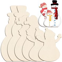 wooden cutouts with snowmen and santa's sleigh