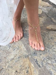 Wedding Barefoot Sandals Add a touch of elegance to your beach wedding with these beautiful handmade barefoot sandals. The anklet design features  beads, and rhinestones, making it perfect for the bride or bridesmaids. The pearls are delicately strung together, creating a charming and romantic look. These sandals are personalized with your choice of size and are suitable for your parties.  this anklet is a unique addition to any jewelry collection. You can take a look at my other products. If you have any questions about custom design or any other questions, please send me a message. Thank you for your visit. I wish you happiness Elegant Adjustable Barefoot Sandals For Beach, Adjustable Beaded Barefoot Sandals For Beach Wedding, Gold Beaded Toe Ring Barefoot Sandals, Gold Toe Ring Sandals For Beach, Gold Beaded Open Toe Barefoot Sandals, Adjustable Toe Ring Barefoot Sandals For Beach Wedding, Gold Bohemian Sandals For Wedding, Gold Toe Ring Barefoot Sandals For Beach Wedding, Elegant Toe Ring Barefoot Sandals For Beach Wedding