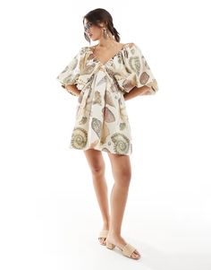 ASOS DESIGN ultimate puffed sleeve v-neck mini smock dress in shell print | ASOS Printed Puff Sleeve Vacation Dresses, Printed Puff Sleeve Dress For Vacation, Vacation Printed Puff Sleeve Dresses, Vacation Puff Sleeve Printed Dresses, Beach V-neck Dress With Gathered Sleeves, Beach Dress With Gathered Sleeves And V-neck, Beige V-neck Mini Dress For Beachwear, Chic Beach Mini Dress With Gathered Sleeves, Summer Beach Mini Dress With Gathered Sleeves