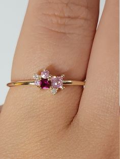 "Ruby Diamond Ring / Cluster Diamond Ring / Cluster Gemstones Ring / Personalized Birthstone Rings / Pink Sapphire Ring / Ruby Ring / Anniversary ring ♥ Features : * Made to Order. * Made in NYC. * Gold: Solid 14K( Also available in18K) *Width of band: 1.3mm * Choice of Gold: Yellow Gold, White Gold, Rose Gold, or Platinum * Gem Stone: Pink Sapphire, Ruby, Mined Diamond * Stones details: * 2PCS Round Diamonds 1.5mm each Diamond Color-Clarity: G Color SI Clarity * 1 Square Pink Sapphire: 2.5x 2.5 14k Gold Birthstone Cluster Ring, Pink Diamond Cluster Ring With Multi-stone, Pink Diamond Cluster Ring With Accent Stones, Diamond Cluster Birthstone Ring For Promise, Pink Diamond Stackable Rings As Gift, Anniversary Rings With Rose Cut Pink Sapphire, Diamond Gemstone Cluster Promise Ring, Pink Diamond Cluster Ring As A Gift, Pink Diamond Cluster Ring For Anniversary