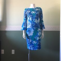 Calvin Klein Long Sleeve Flower Dress Polyester 94% Spandex 6% Blue Floral Print Knee-length Dress, Elegant Blue Floral Long Sleeve Dress, Elegant Blue Long Sleeve Floral Dress, Elegant Long Sleeve Blue Floral Dress, Fitted Green Floral Dress, Floral Print Sheath Dress For Garden Party, Sheath Dress With Floral Print For Garden Party, Blue Floral Print Sheath Midi Dress, Chic Blue Fitted Floral Dress